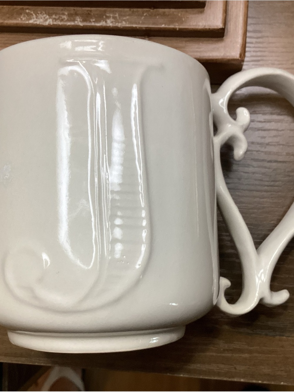 Pottery Barn Cream Embossed Ceramic Mug with Curled Handle “J”